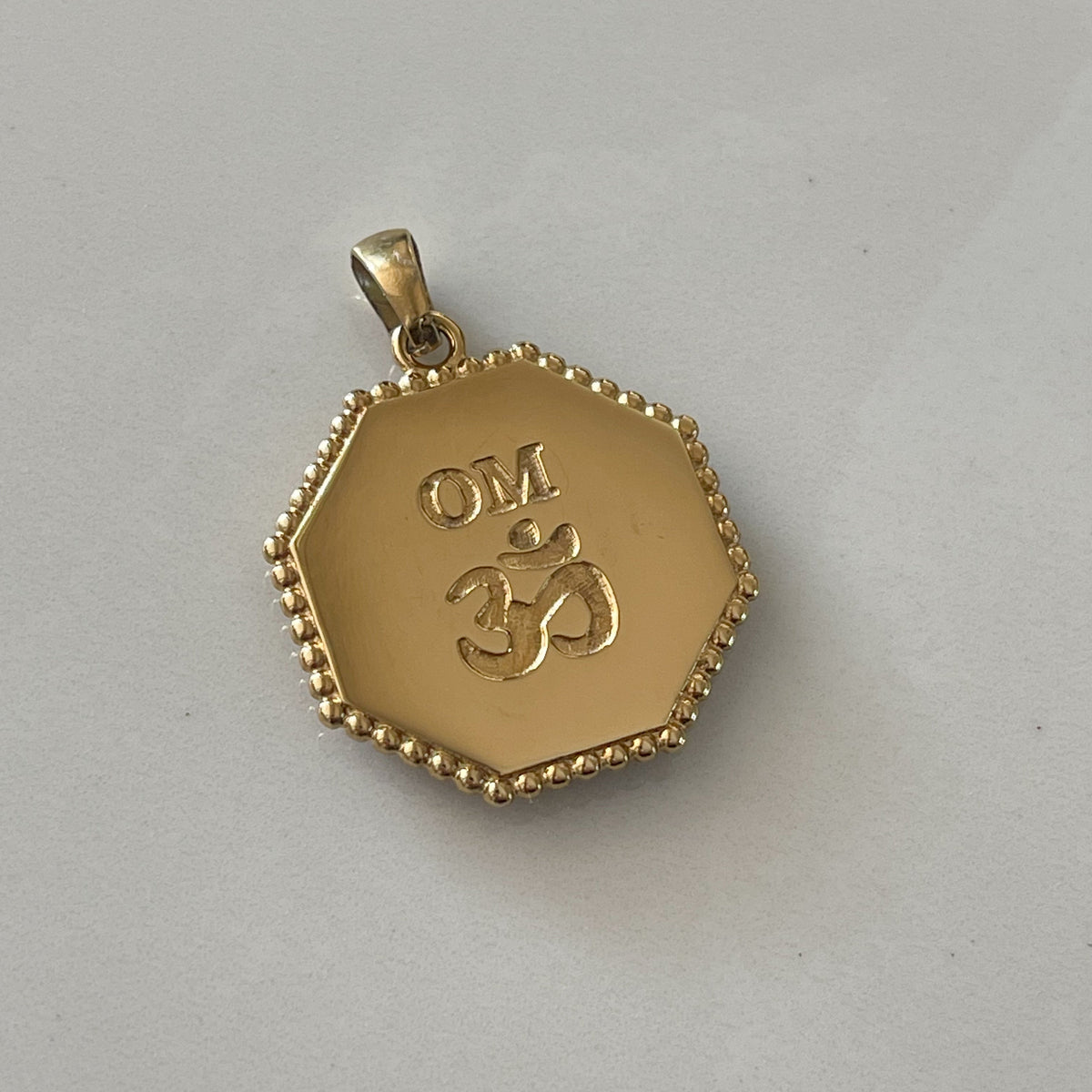 OM Medallion